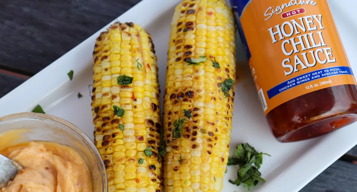 View Grilled Corn with Hot Honey Chili Butter Sauce Gallery - Image 1 Grilled Corn with Hot Honey Chili Butter Sauce